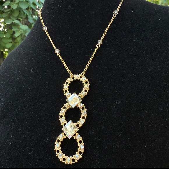 Belladonna Circular Crystal and Gold Tone Infinity Pendant Necklace - Picture 16 of 17